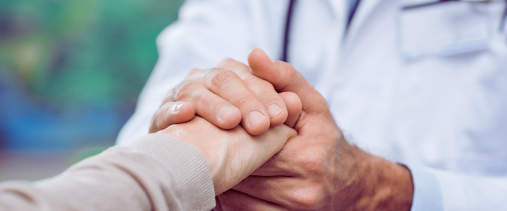 personal-injury-doctor-holding-patients-hand