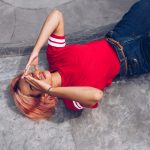 woman-lying-on-ground-after-slip-and-fall-accident