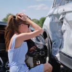 young-woman-holding-head-in-pain-after-car-accident-personal-injury